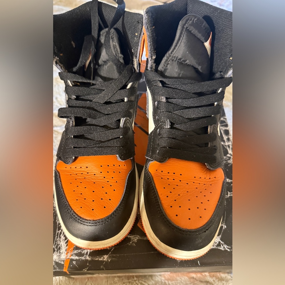 Black and Orange Air Jordan 1 high OG shattered backboard.